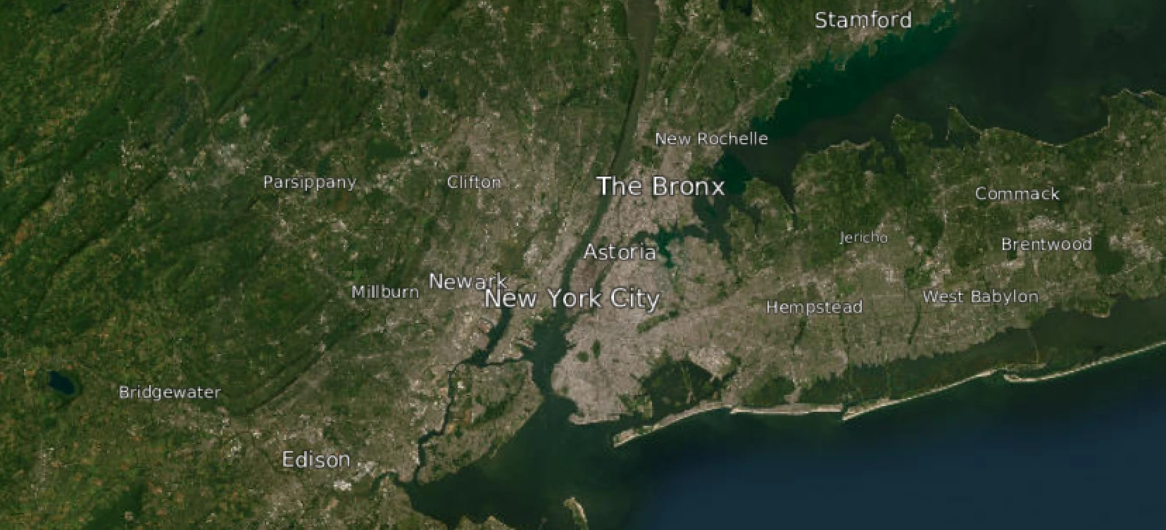 A satellite map of a large area around New York City, with labels for cities scaled to their population.