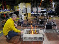 Shawn Urbanski conducting experiment in combustion chamber