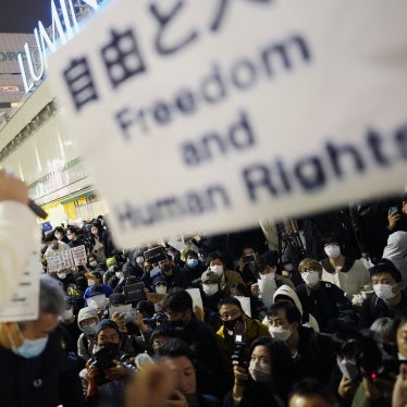 Protesters rally in Tokyo to support the victims of a recent fire in Urumqi, the capital of China's Xinjiang region, November 30, 2022.