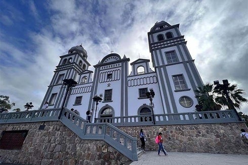 A church with a stone wall and a stone staircase. Institutional Strengthening - Inter-American Development Bank - IDB