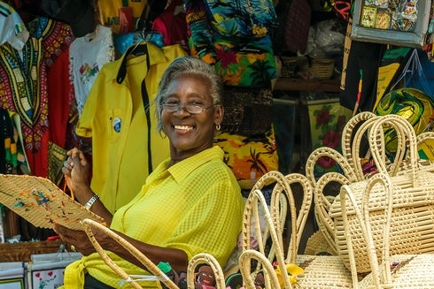 a person smiling at a market Information - Inter-American Development Bank - IDB