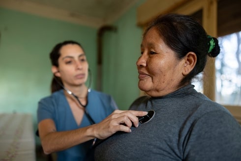 A doctor With An Old Woman - Investor - Inter American Development Bank - IDB