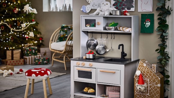 A grey SILLTRUT kitchen for children in the living room