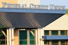 A photo of the front of a credit union, with the words "Federal Credit Union."