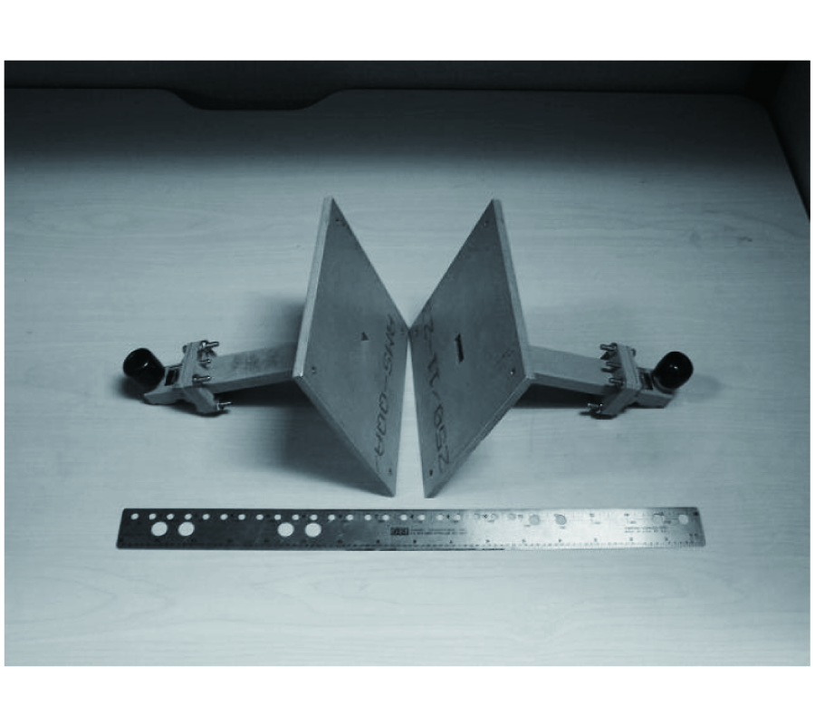 A NONDESTRUCTIVE TECHNIQUE FOR DETERMINING COMPLEX PERMITTIVITY AND PERMEABILITY OF MAGNETIC SHEET MATERIALS USING TWO FLANGED RECTANGULAR WAVEGUIDES