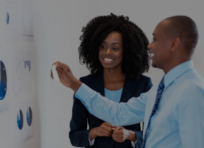 Business partners having discussion by a whiteboard