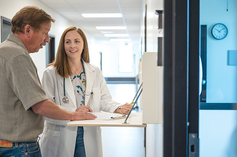 Doctor of nursing student consulting with patient