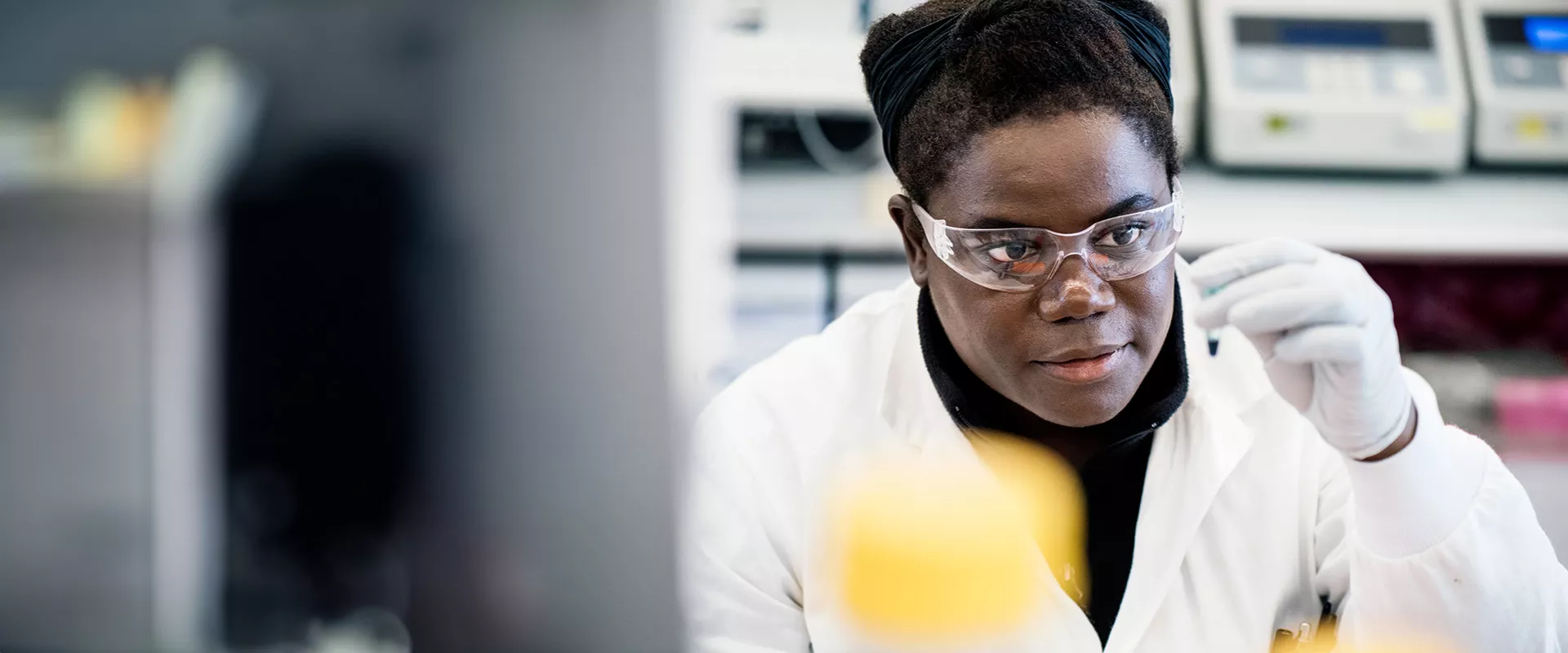 Research scientist in a lab looking at a sample