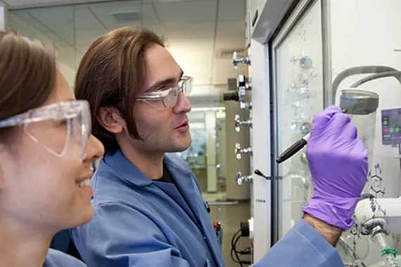 Two scientists examine a slide