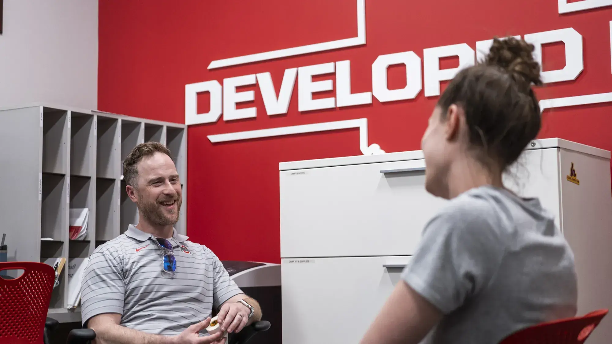 two people sit across from one another while talking