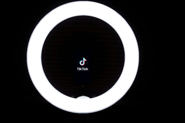 The TikTok logo seen in a ring light