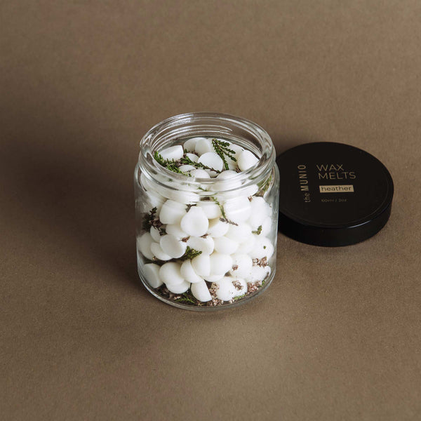 Heather mini soy wax melts in a glass votive