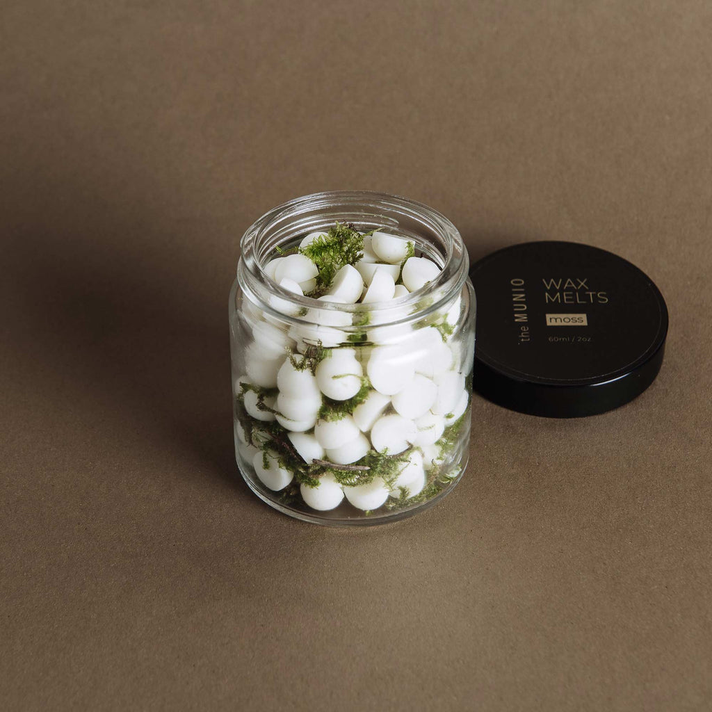 Moss mini soy wax melts in a glass votive