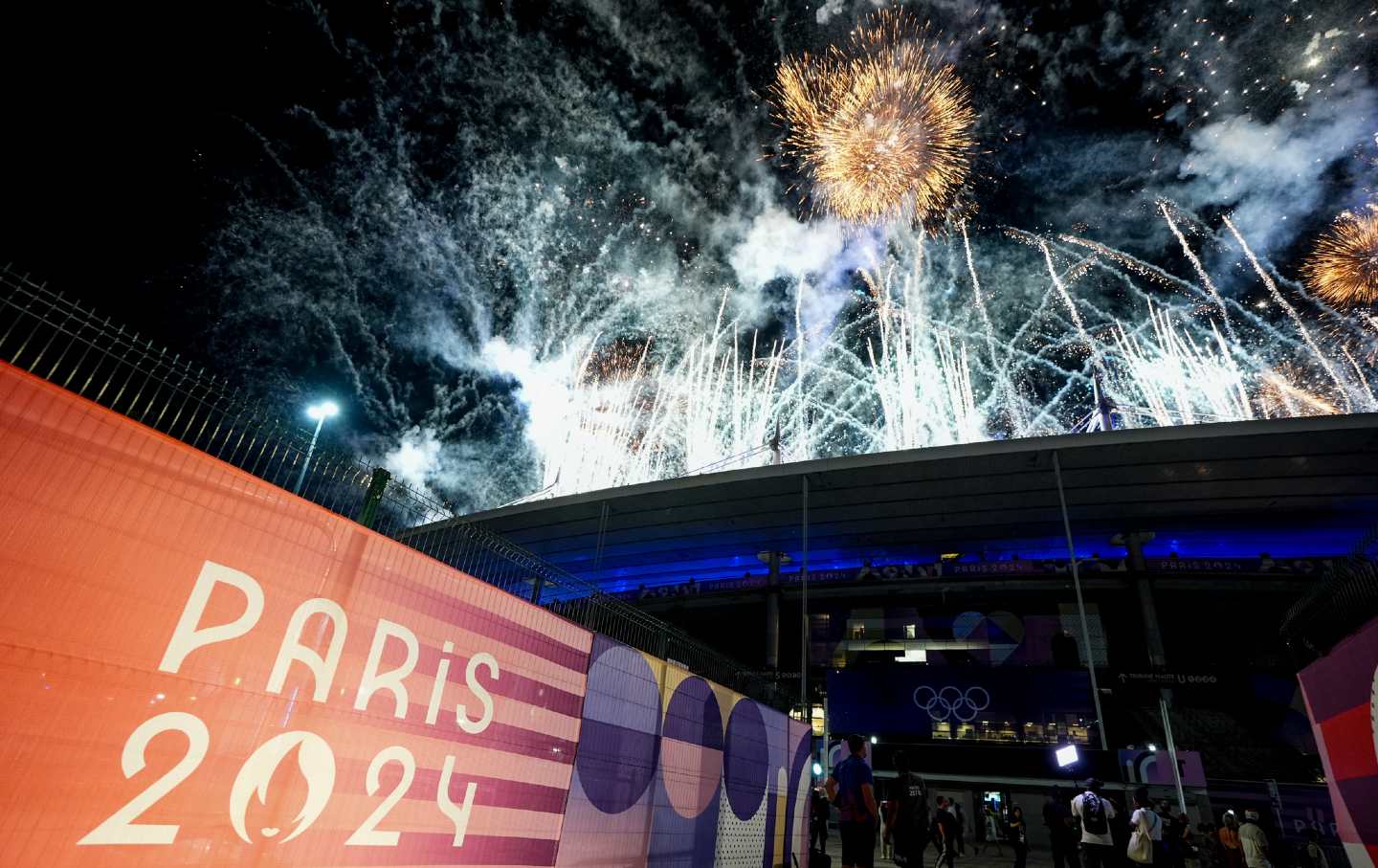 Fireworks illuminate the sky at the end of the closing ceremony of the Paris 2024 Olympic Games at the Stade de France on August 12, 2024, in Paris, France.