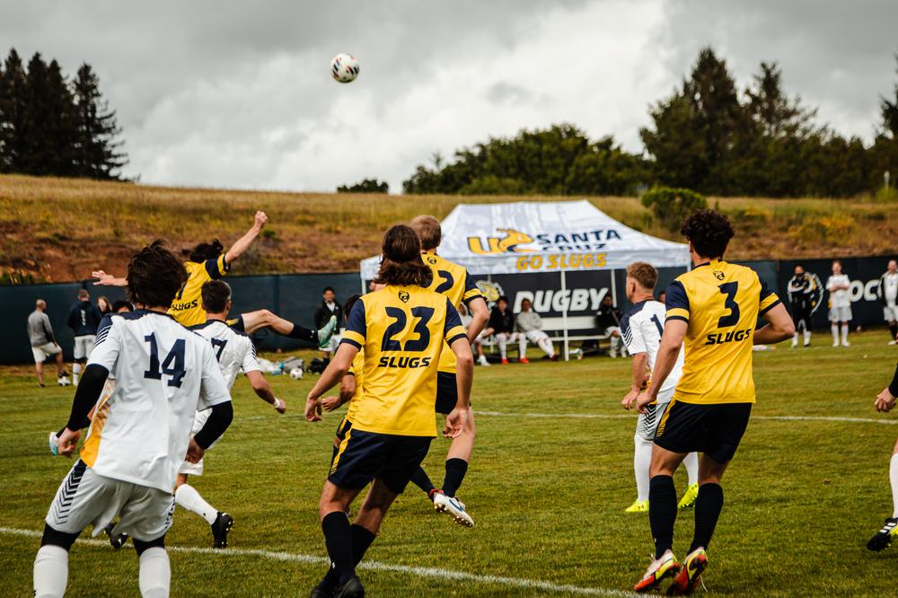 Mens soccer team playing game.