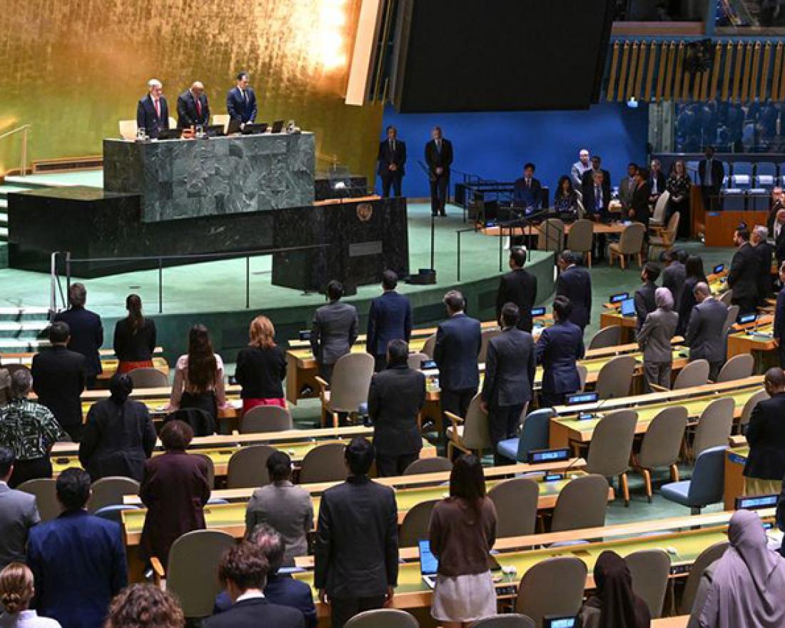 UN Photo/Evan Schneider. A wide view of the GA Hall as a moment of silent prayer is held during the final plenary meeting of its 78th session.