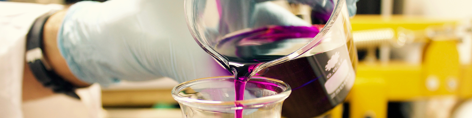 hand with a poured purple liquid