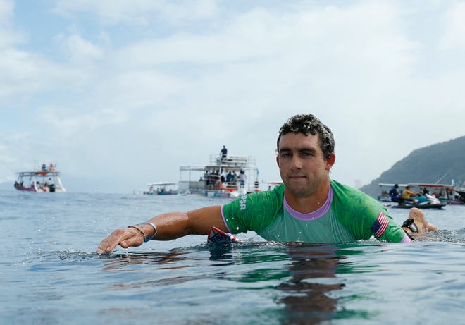 US' Griffin Colapinto paddles out in the 7th heat of the men's surfing round 1, during the Paris 2024 Olympic Games, in Teahupo'o, on the French Polynesian Island of Tahiti, on July 27, 2024.