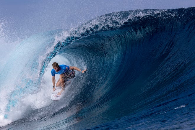 John John Florence of Team United States rides a wave during round one of surfing on day one of the Olympic Games Paris 2024 at on July 27, 2024 in Teahupo'o, French Polynesia.