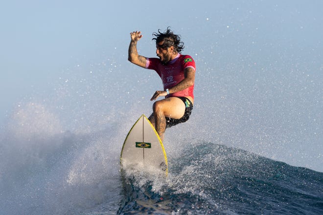 Brazil's Felipe Toledo reacts as he exits a wave during round two of surfing on day two at the Paris 2024 Olympic Games on July 28, 2024, in Teahupo'o, French Polynesia.