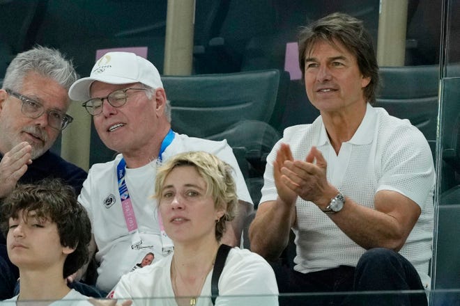 CEO and president of Warner Bros. Discover David Zaslav and Tom Cruise attend women’s qualification during the Paris 2024 Olympic Summer Games at Bercy Arena on July 28, 2024.