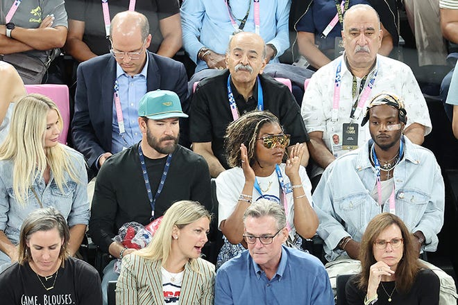 From left: Catriona McGinn, husband Mark-Paul Gosselaar, Actress Taraji P Henson, glasses, and her son Marcell Johnson watch the Men's basketball quarterfinal game between Team United States and Team Brazil on day eleven of the Olympic Games Paris 2024 at Bercy Arena on August 6, 2024 in Paris, France.