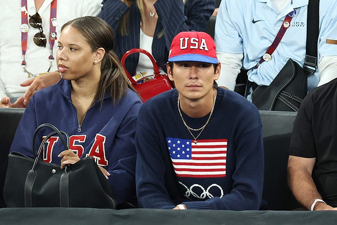 American model, actor, and skateboarder, Evan Mock looks on during a Men's basketball semifinals match between Team United States and Team Serbia on day thirteen of the Olympic Games Paris 2024 at Bercy Arena on August 8, 2024 in Paris, France.