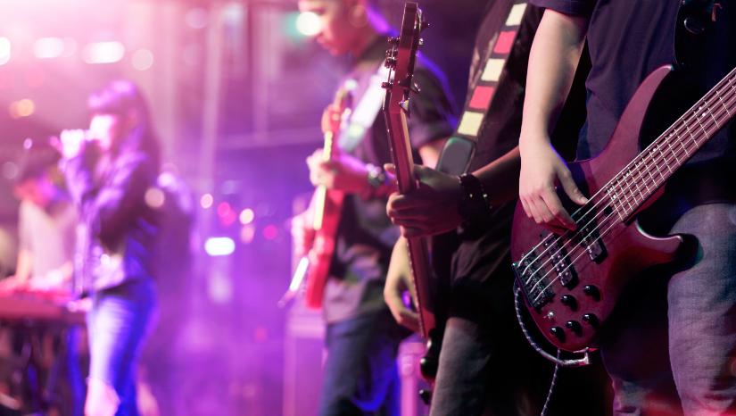 guitarists on stage. Adobe Stock