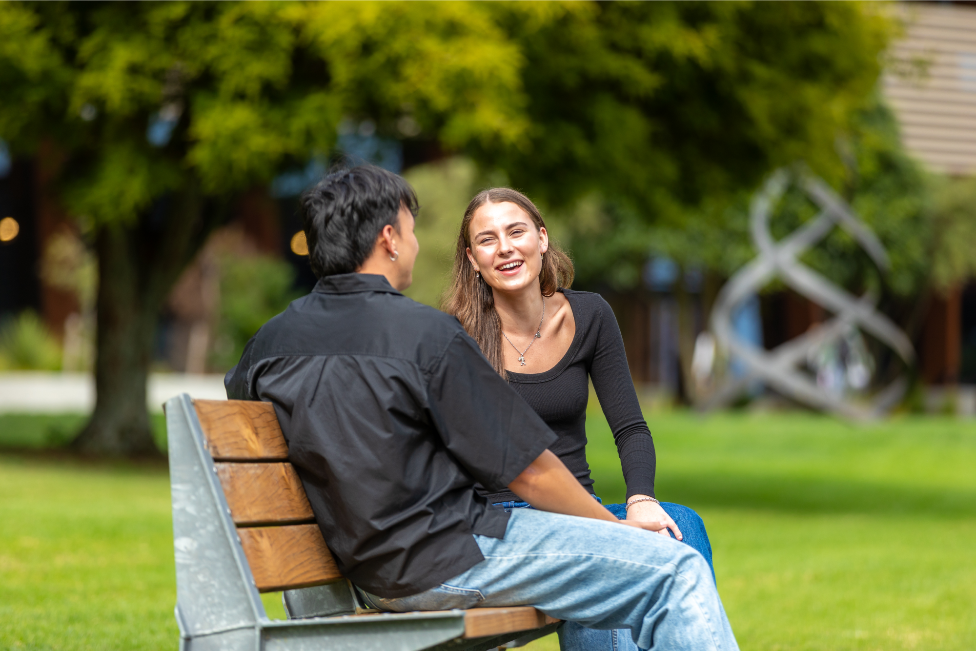 students-sitting-outside-talking-sunny