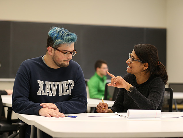 Students in the philosophy major learning from a Jesuit professor