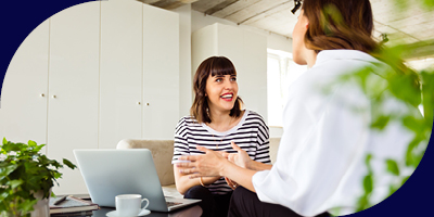 Two female colleagues talking